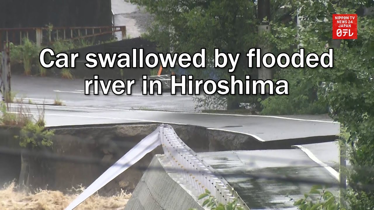 Car swallowed by flooded river in Hiroshima